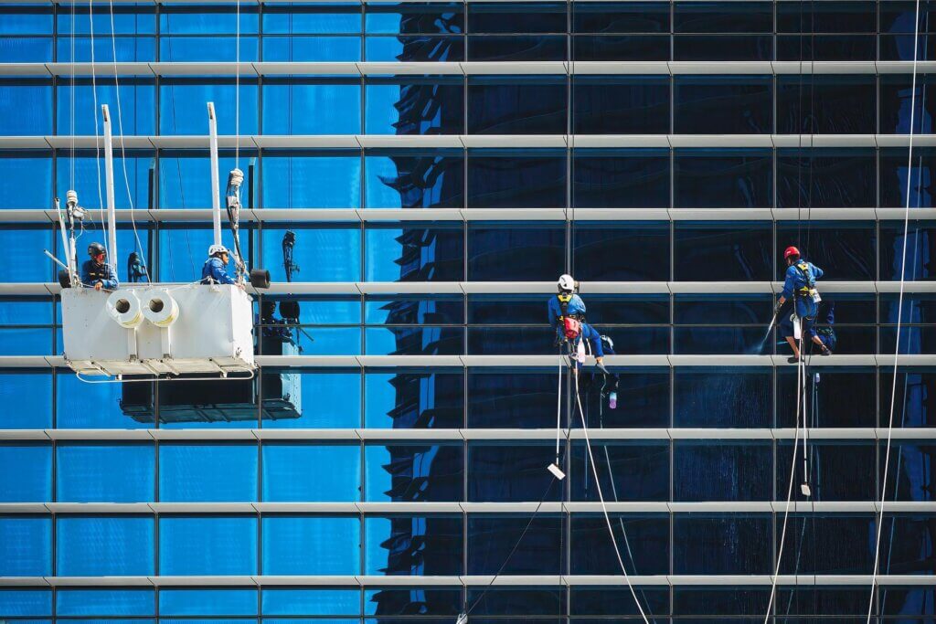 Rope Access workers cleaning high-rise windows